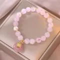 Detail eines rosa Kristallperlenarmbands mit Süßwasserperle und Rosenquarz-Anhänger - Rosenquarz Süßwasserperle Friedensschnalle Stil (TS0002)