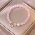 Rosa Kristallperlenarmband mit Süßwasserperle und funkelndem goldenen Schleifenanhänger - Rosenquarz Süßwasserperle Schleifenstil (TS0133)