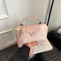 Pink nylon and leather dumpling bag with adjustable shoulder strap and top handle - Light Pink
