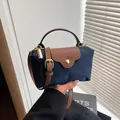 Mini navy nylon crossbody bag with brown leather flap and golden hardware accents - Dark Blue