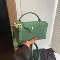 Minimalist green color-block handbag with textured flap and elegant gold buckle - Green
