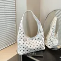 White hobo shoulder bag with silver metal rivets and vintage rock fashion style - White