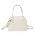 Elegant off-white dome shell bag in textured lychee leather with silver hardware - White