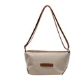 Waterproof nylon crossbody bag in beige featuring brown leather trim and silver hardware - Khaki