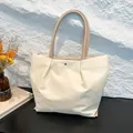 Minimalist waterproof nylon tote bag in cream with pleated design and brown leather straps - White