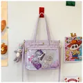 Lavender purple ita bag with clear PVC window and plush rabbit charm on a studio wall - Purple
