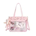 Pink ita bag with large transparent PVC window and plush charm for anime collection - Pink