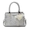 Silver snakeskin tote bag with woven handle and pearl lace heart charm on white background - Silver