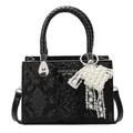 Black snakeskin tote bag with woven handles and pearl heart charm accessory - Black