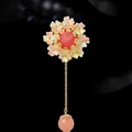Elegant floral brooch with pink gemstone and iridescent petals on gold chain - Floral Tassel Style (XX0085)
