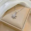 Macro view of snowflake pendant necklace with sparkling cubic zirconia on jewelry box - Rotating Snowflake Necklace (X0142) / Silver