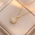 Elegant gold necklace with sparkling zircon sunflower pendant on jewelry box - Rotating Sunflower Necklace (X0449) / Gold