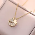 Goudkleurige roestvrijstalen klaverketting met hartjes en fonkelende witte kristallen - Gouden Klavertje Vier Bloem Ketting (X0001)