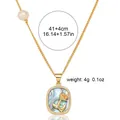 Detailed view of golden whale tail pendant with abalone shell inlay and pearl accent - Abalone Shell Rose (X0940) / Necklace