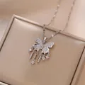 Silver bow butterfly tassel necklace with pavé cubic zirconia on premium leather surface - Steel Micro-Pave Star Butterfly Tassel Style (X1462) / Steel