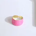 Detail of pink marble enamel wide open ring with polished gold edges and adjustable band - Pink