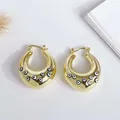 Detail view of 18K gold-plated wide hoop earrings with multi-color evil eye enamel inlay - Black