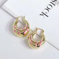 Chunky 18K gold plated hoop earrings with pink evil eye patterns on a white background - Pink