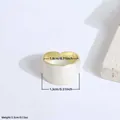 Exaggerated wide open ring with cream marble resin finish and gold trim details - White