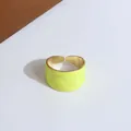 Exaggerated wide open ring with neon yellow wavy texture and polished gold interior - Yellow