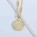 Macro detail of golden religious pendant with white enamel inlay and beaded chain - White