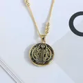 Detailed close-up of a gold Saint Benedict pendant with black enamel and beaded chain - Black