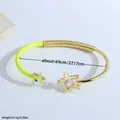 Brazalete abierto de oro de 18K con ojo turco, esmalte amarillo y detalles de estrella - Amarillo