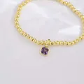 18k gold plated beaded bracelet featuring a square purple zircon gemstone pendant - February (Amethyst Zirconia)