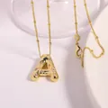 Collar dorado con colgante de letra A y circonitas sobre una cadena de cuentas finas - Letra A