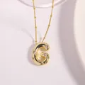 Gold plated alphabet G letter necklace with shimmering cubic zirconia and bead chain - Letter G
