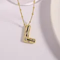 Gold-plated letter L pendant necklace featuring textured lava finish and sparkling zircons - Letter L