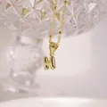 Polished 18K gold plated bubble letter H pendant necklace with elegant beaded chain - Letter H
