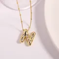 Gold letter N pendant necklace with lava texture and sparkling cubic zirconia stones - Letter N