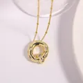 Gold letter necklace with irregular round pendant and sparkling zircon accents - Letter Q