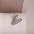 Silver 'V' initial necklace with pave-set zircons on a delicate beaded chain - Letter V