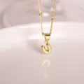 Polished 18K gold-plated bubble letter U pendant necklace with a fine bead chain - Letter U