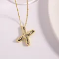 Gold plated initial X necklace featuring brilliant round cubic zirconia on bead chain - Letter X