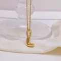 Polished 18K gold letter L balloon pendant necklace with crystal accents and bead chain - Letter L