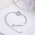 Bracelet chaîne trombone argentée avec pendentif rond serti de zircons lettre A - Lettre O