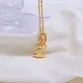 Golden 3D balloon initial Z pendant necklace with zircon collar on a satin background - Letter Z