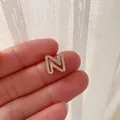 Sparkling gold N alphabet pendant with clear zircon stones for personalized jewelry - Letter N