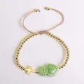 18K gold beaded bracelet with green sacred heart and cross charms on beige cord - Dark Green
