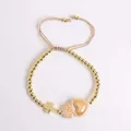 18K gold beaded bracelet featuring a gold cross and caramel heart pendant - Khaki