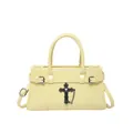 Light yellow gothic tote bag with black cross pendant and glossy finish texture - Yellow