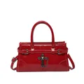 Elegant red glossy handbag with vintage cross pendant and adjustable shoulder strap - Red
