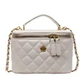 Quilted cream chain handbag with gold floral accent and leather woven shoulder strap - Off White