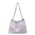 Quilted lavender shoulder bag with rhinestone accents and silver star emblem - Purple