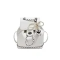 Mini white leather backpack featuring pearl bow charm and silver chain details - With Ornament / Off White