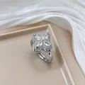 Macro shot of silver clover ring with marquise-cut zircons and pavé diamond detailing - Four-leaf Open Ring (J0007) / Steel Ring