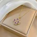 Elegant gold necklace featuring a purple zircon heart-shaped clover pendant on silk - Necklace / Purple Necklace